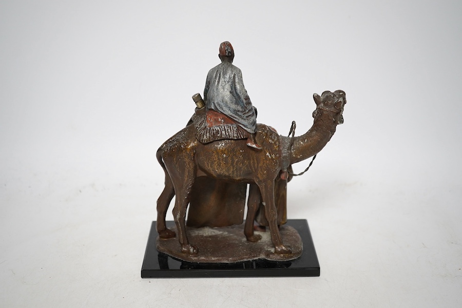 An Austrian cold painted bronze lighter in the form of a camel and two figures, approximately 17cm wide. Condition - worn in places, unchecked if working